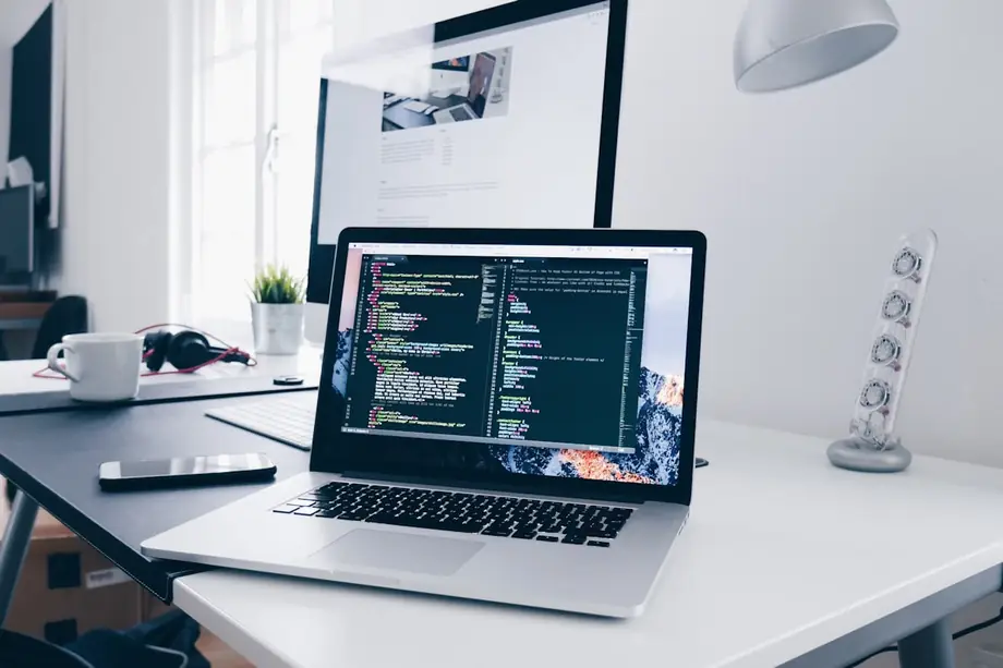Code for a custom dental website on a laptop